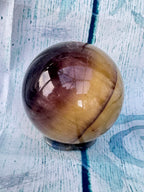 Polished banded fluorite sphere