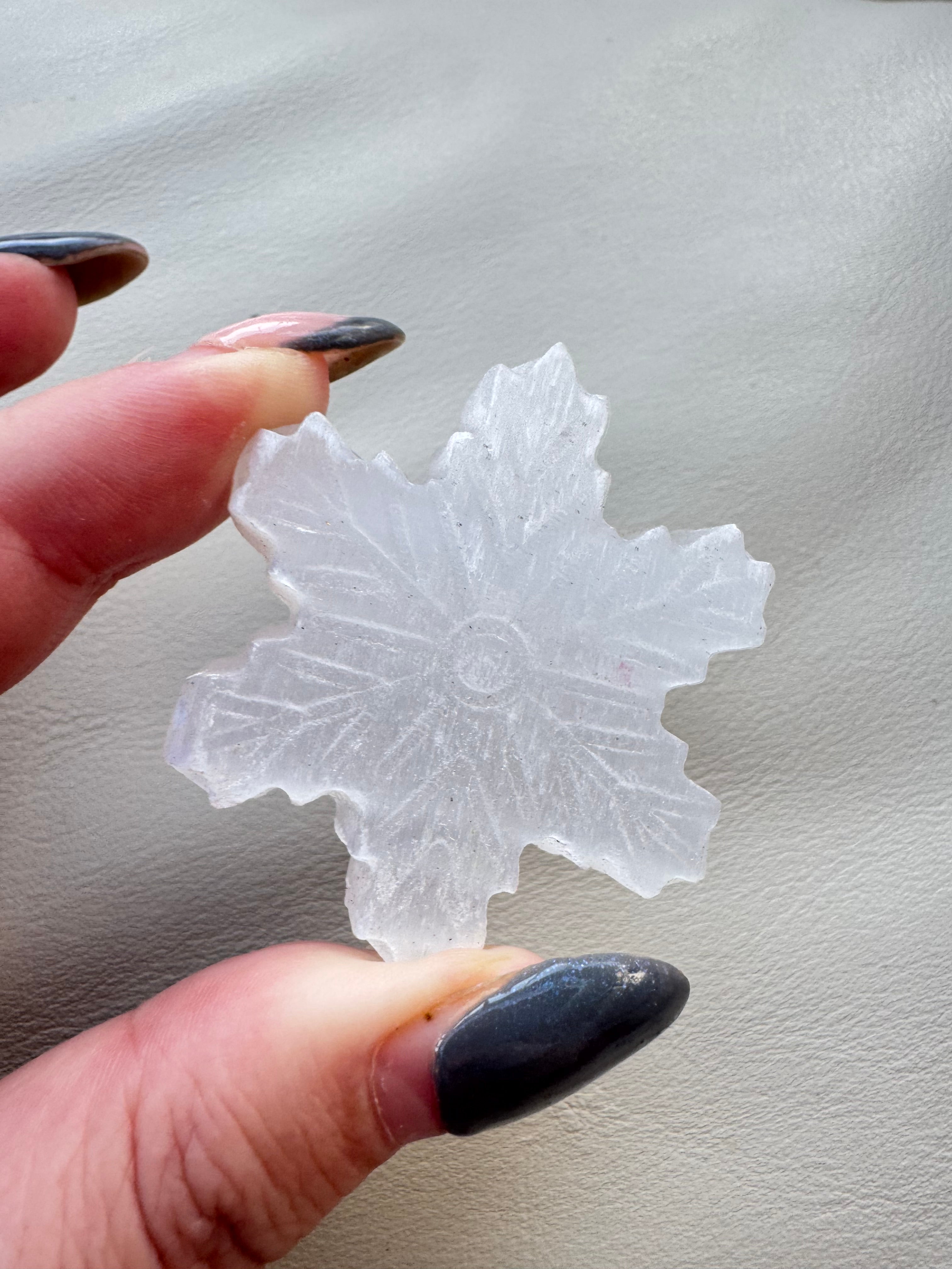 Carved selenite snowflake