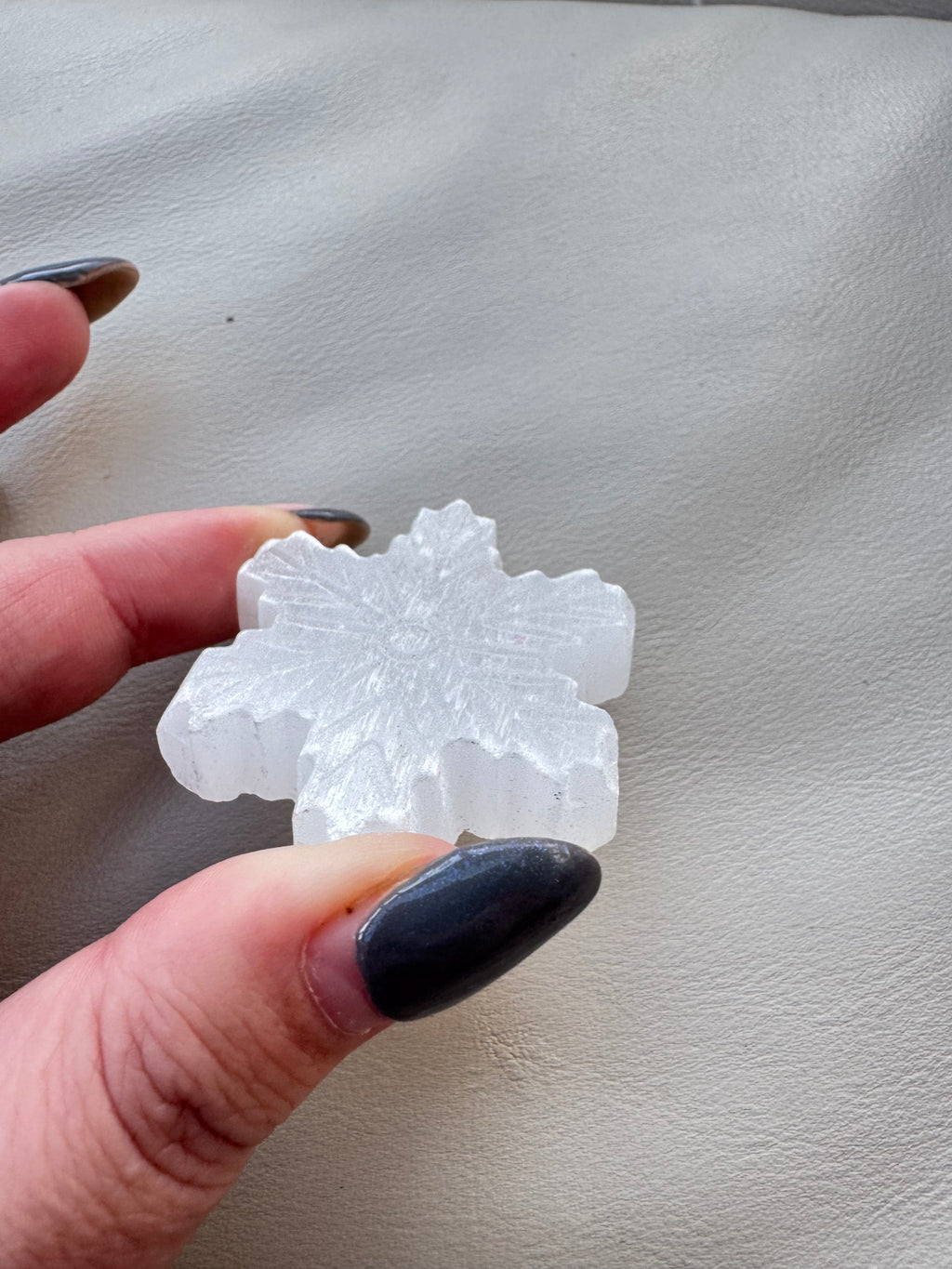 Carved selenite snowflake
