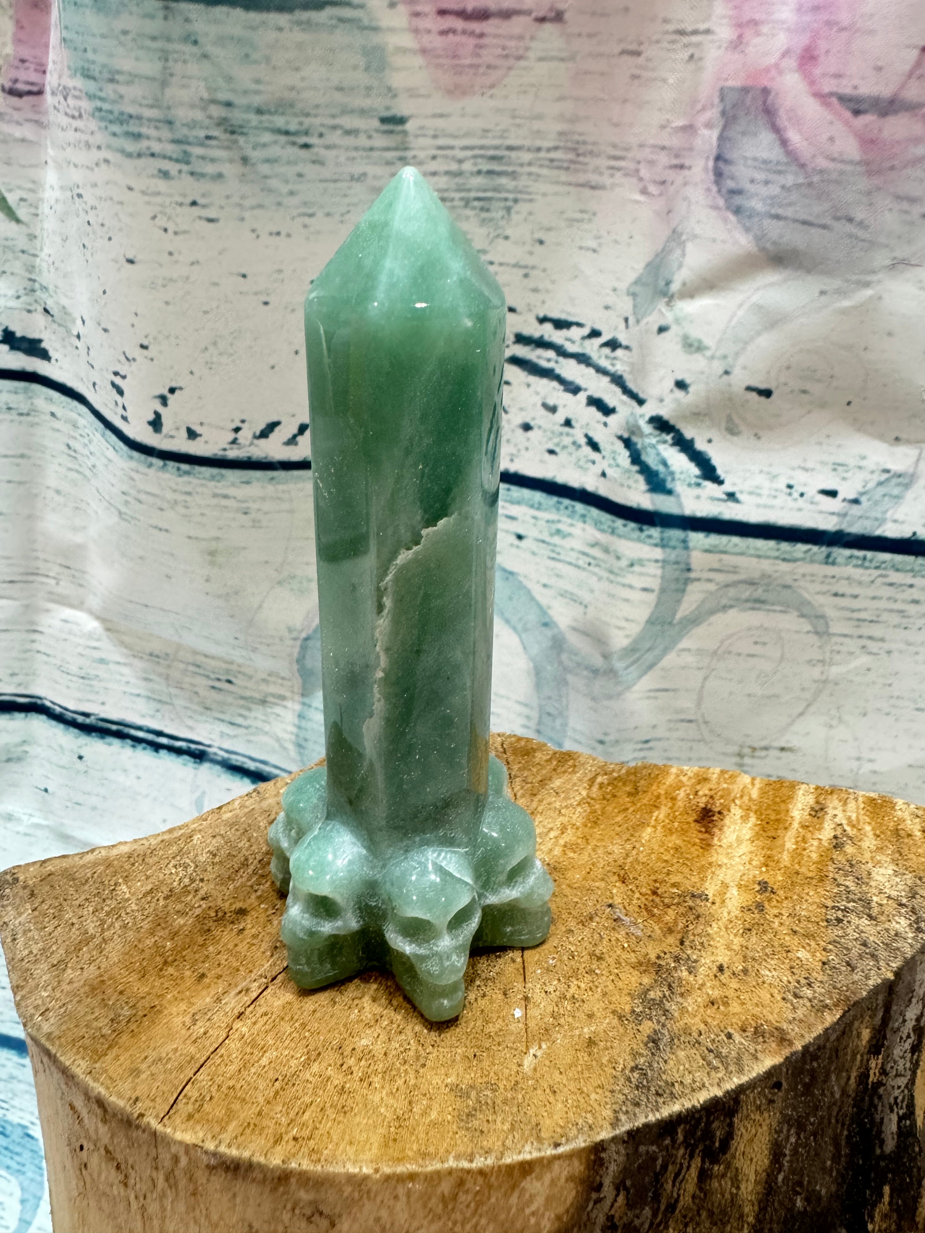 Aventurine carved tower with skull base