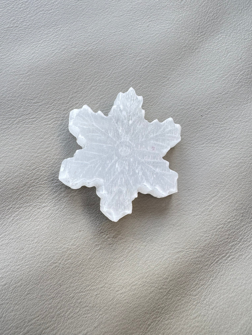 Carved selenite snowflake