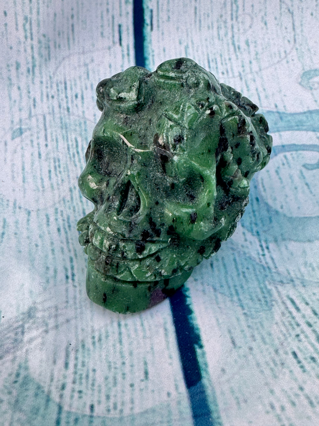 Ruby in zoisite carved crystal skull