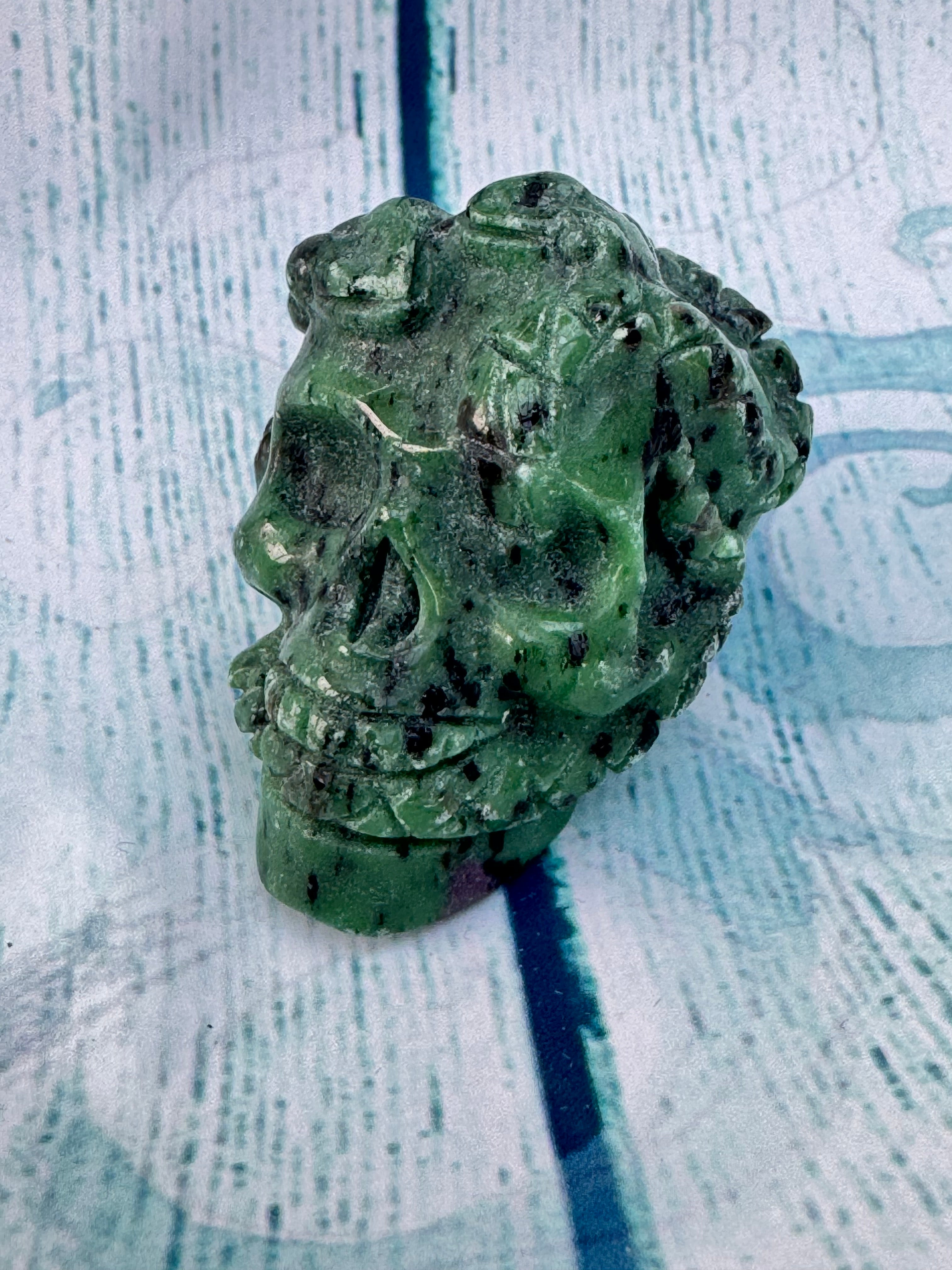 Ruby in zoisite carved crystal skull
