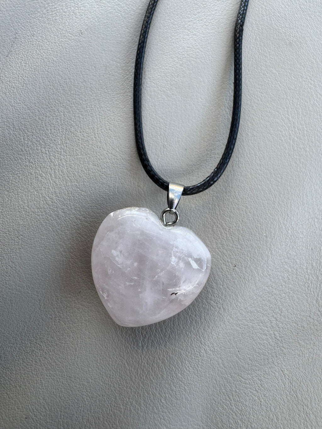 Rose quartz heart pendant.