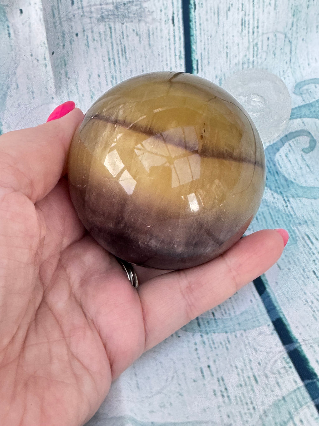 Polished banded fluorite sphere