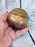 Polished banded fluorite sphere