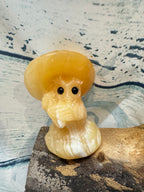 Yellow Calcite Carved Owl Under a Toadstool