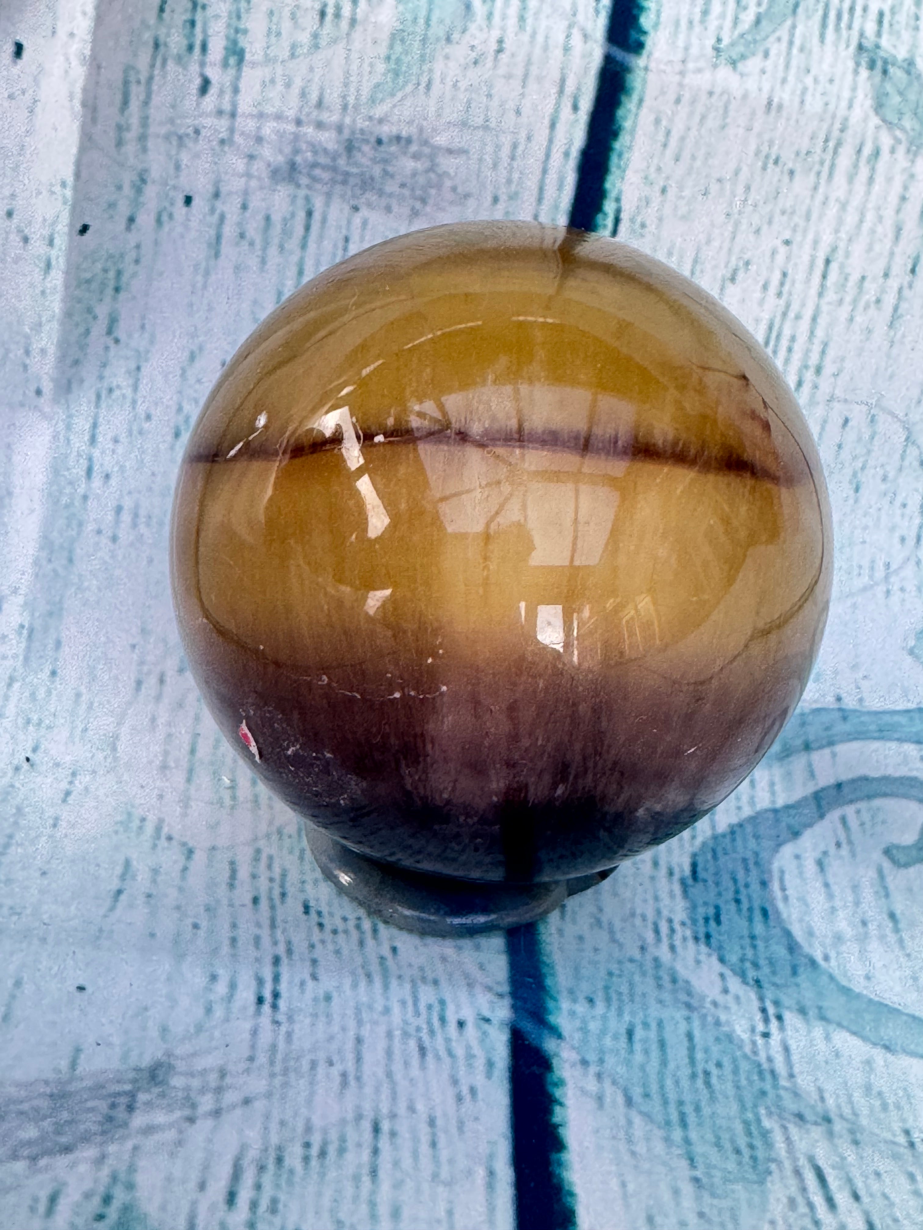 Polished banded fluorite sphere