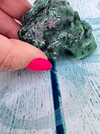 Ruby in zoisite carved crystal skull