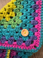 Colourful crocheted book sleeve