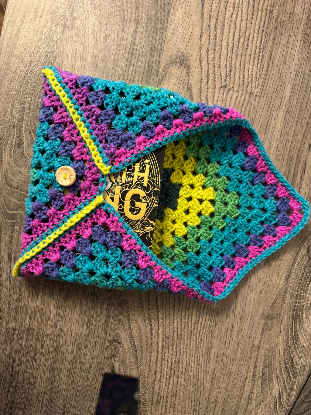 Colourful crocheted book sleeve