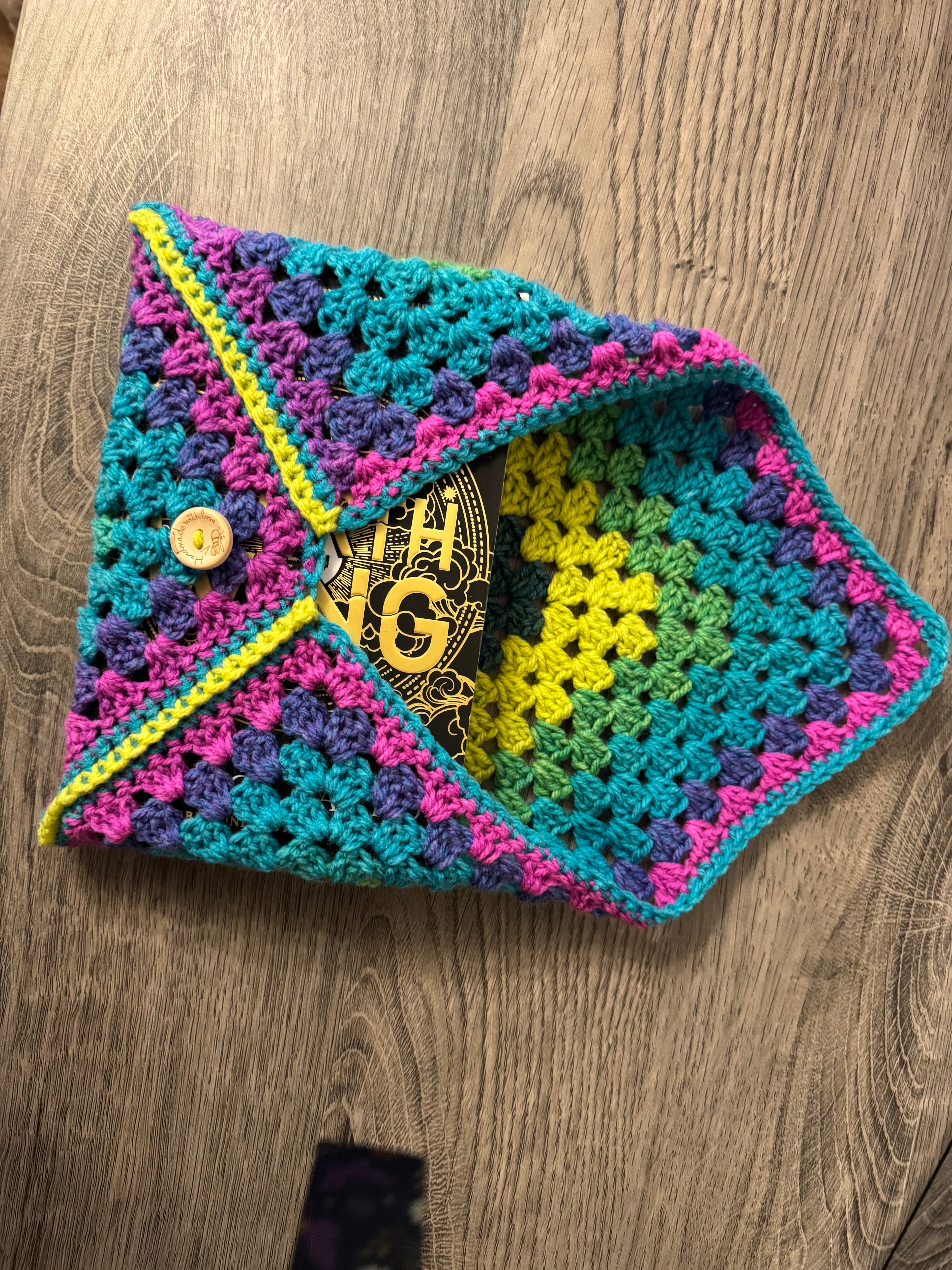 Colourful crocheted book sleeve