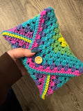 Colourful crocheted book sleeve