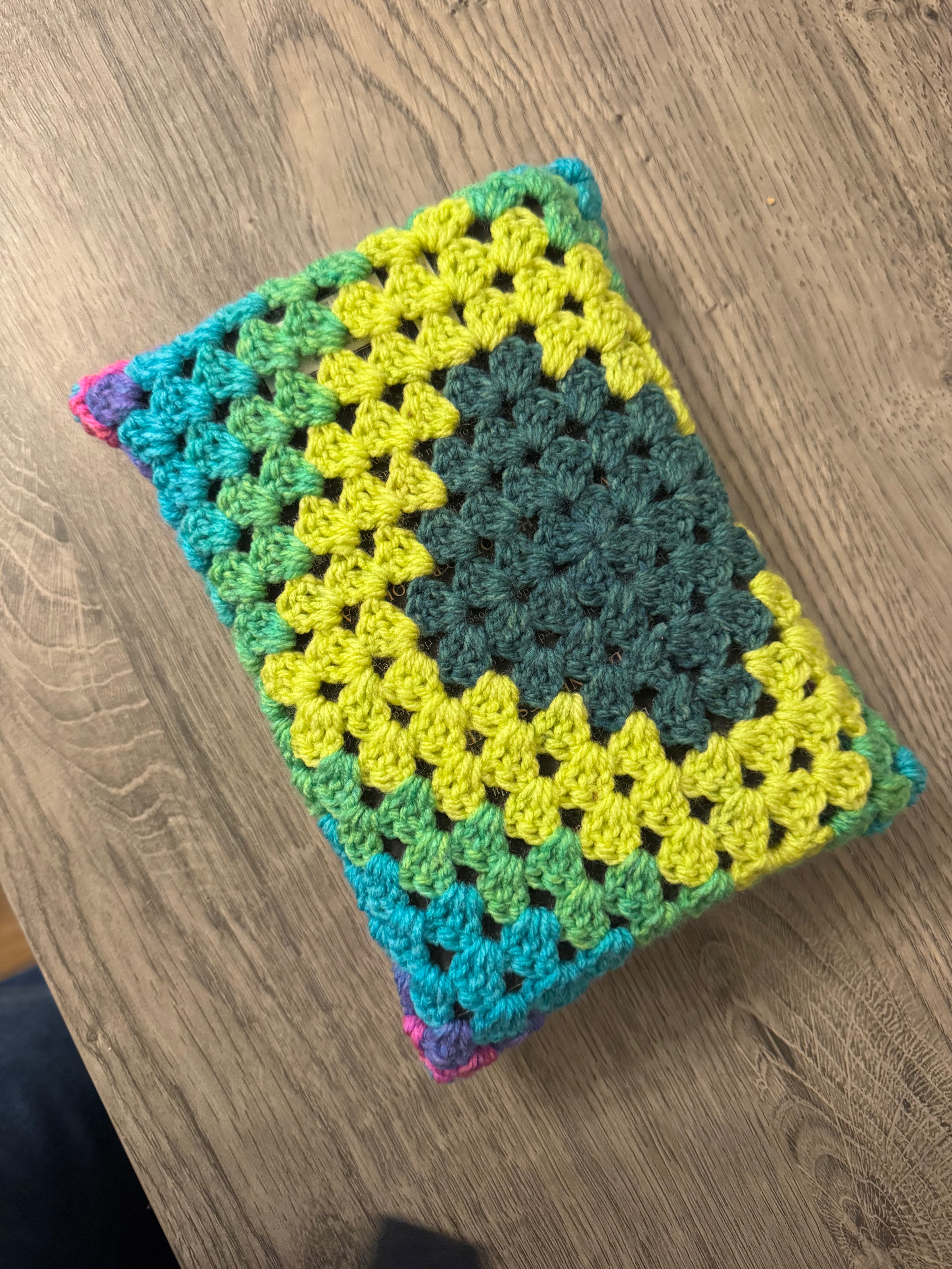Colourful crocheted book sleeve