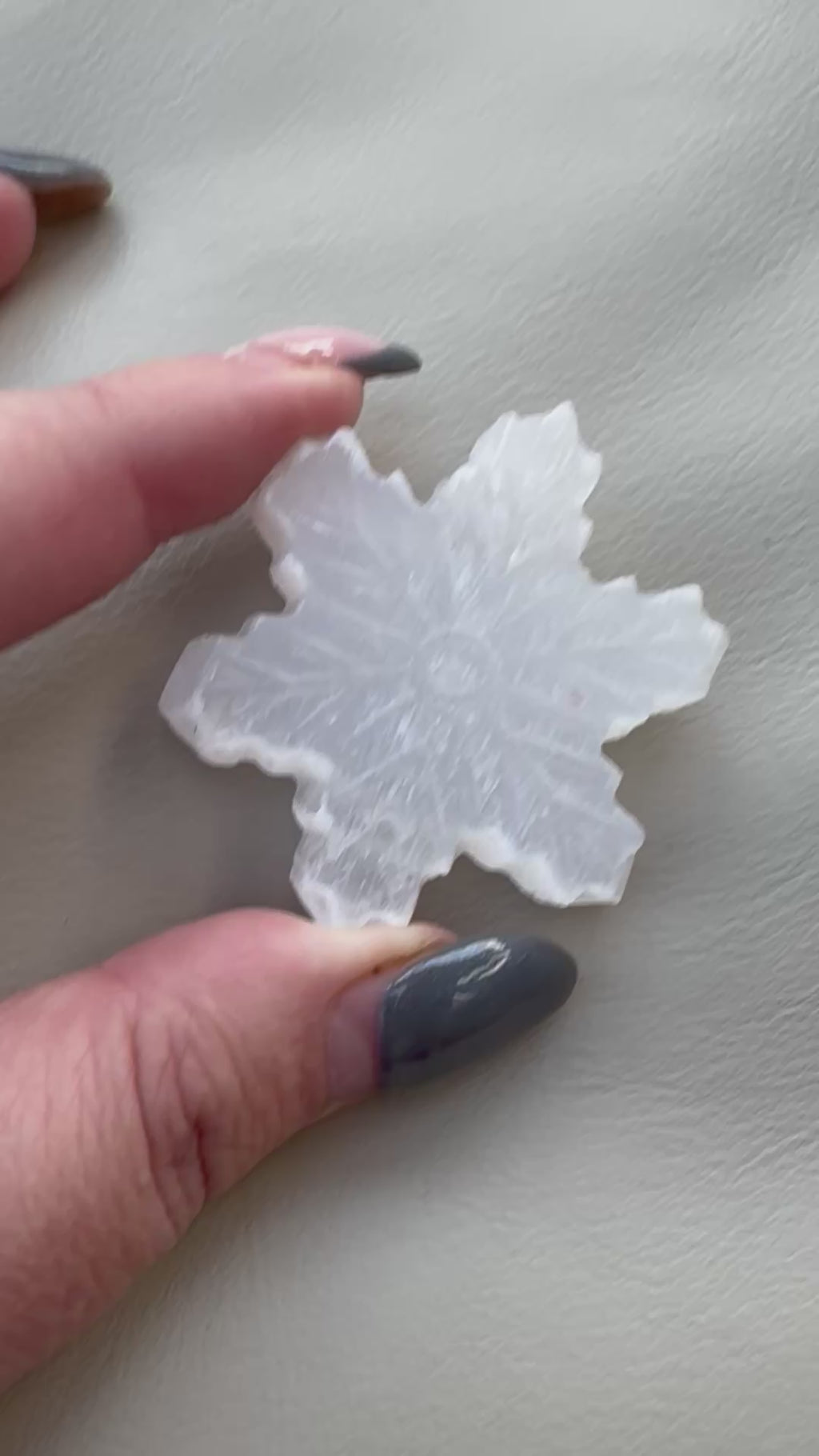 Carved selenite snowflake
